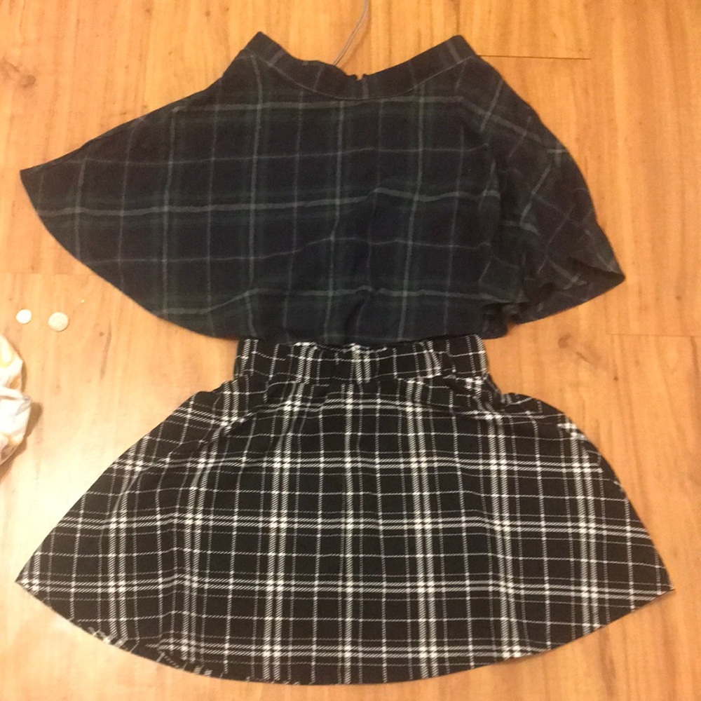 2 green and black skirts